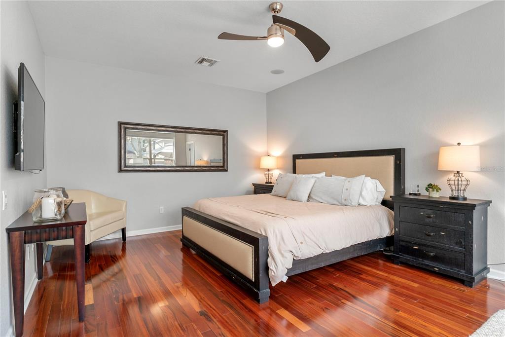 13320 Fernow Street Windermere, FL 34786 - Photo 23 of 52 a bedroom with a bed and wooden floor