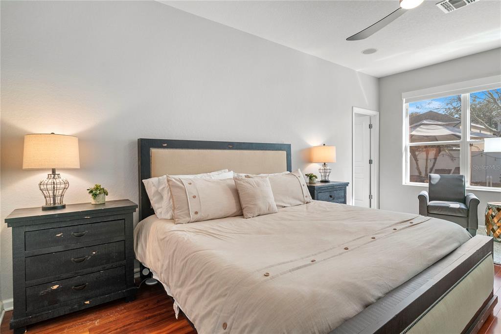 13320 Fernow Street Windermere, FL 34786 - Photo 24 of 52 a bedroom with a bed and large windows