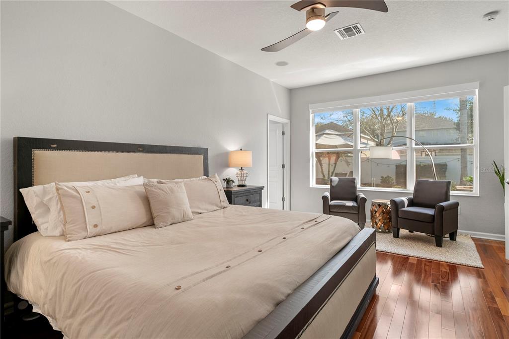 13320 Fernow Street Windermere, FL 34786 - Photo 25 of 52 a bedroom with a large bed and a large window