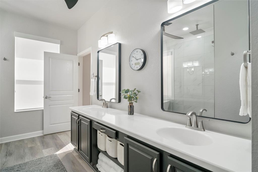 13320 Fernow Street Windermere, FL 34786 - Photo 29 of 52 a bathroom with double vanity and a mirror
