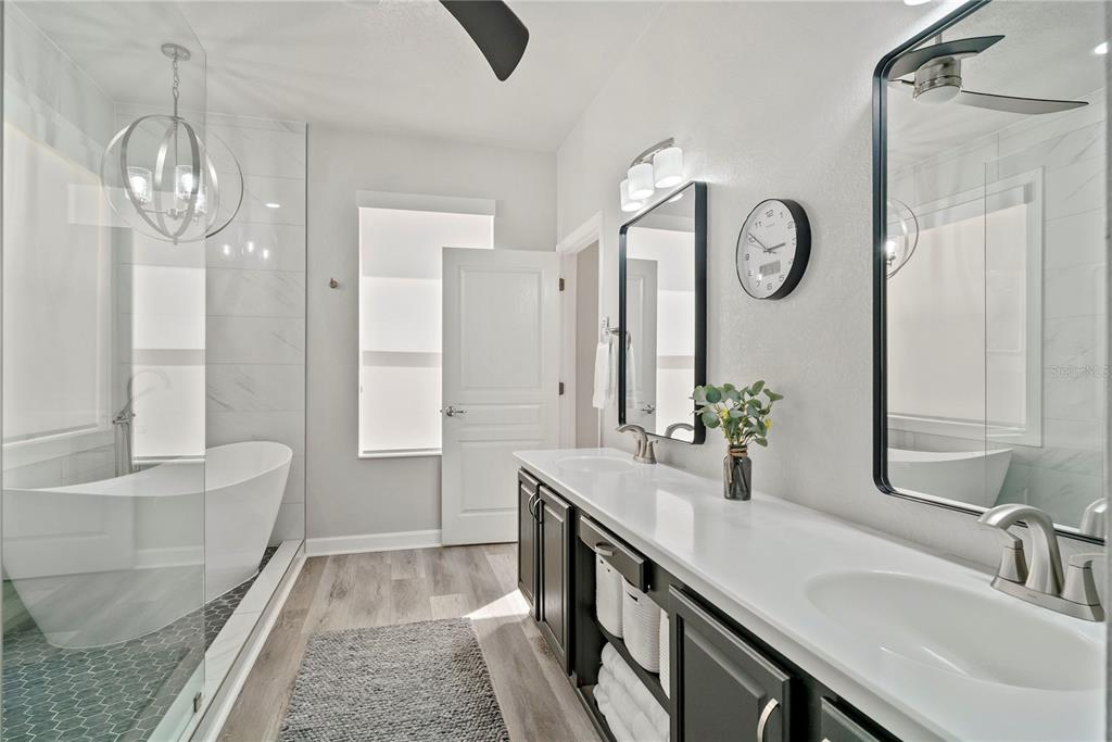 13320 Fernow Street Windermere, FL 34786 - Photo 30 of 52 a bathroom with a double vanity sink mirror and bathtub