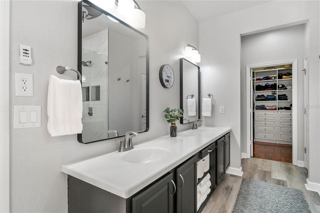 13320 Fernow Street Windermere, FL 34786 - Photo 31 of 52 a bathroom with a double vanity sink a and mirror