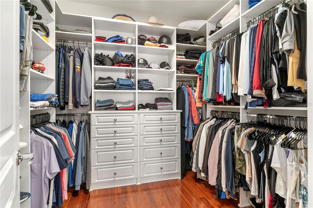 13320 Fernow Street Windermere, FL 34786 - Photo 32 of 52 a view of walk in closet with clothes and shoes