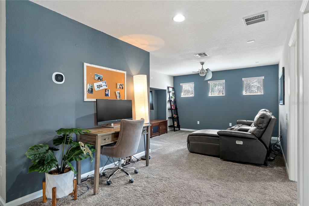 13320 Fernow Street Windermere, FL 34786 - Photo 34 of 52 a living room with furniture a potted plant and a window