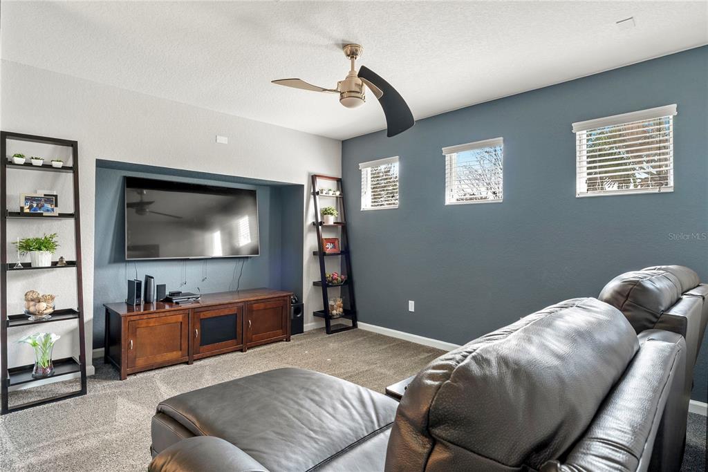 13320 Fernow Street Windermere, FL 34786 - Photo 35 of 52 a bedroom with furniture and a flat screen tv