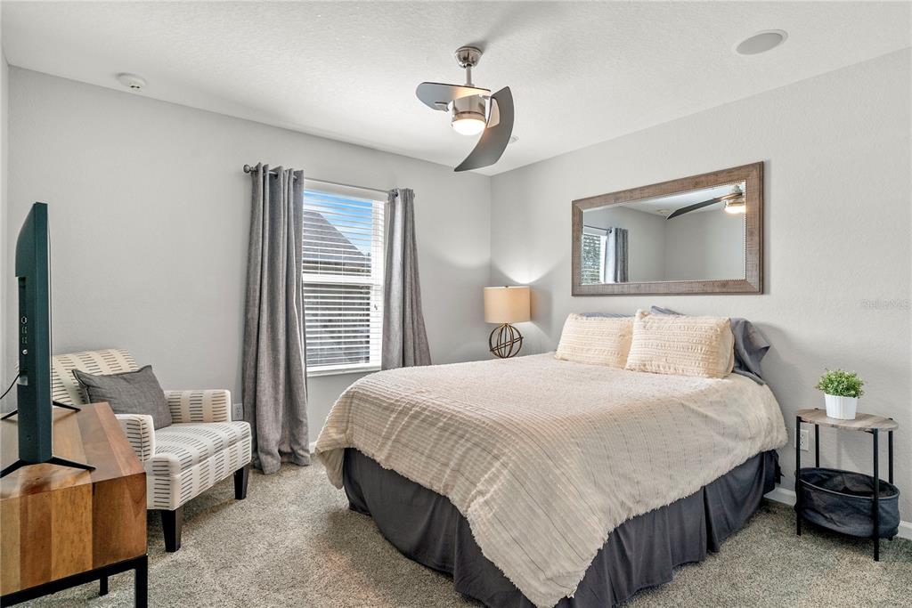 13320 Fernow Street Windermere, FL 34786 - Photo 37 of 52 a bedroom with a bed and a couch