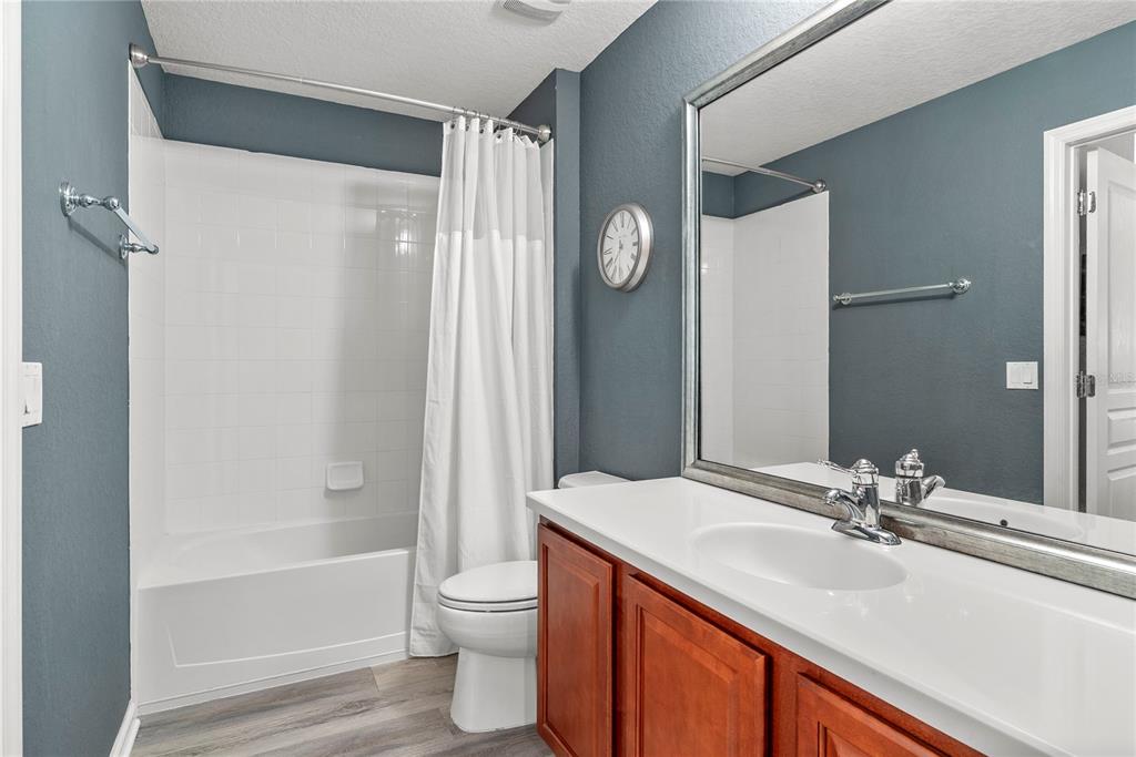 13320 Fernow Street Windermere, FL 34786 - Photo 39 of 52 a bathroom with a granite countertop sink toilet and shower