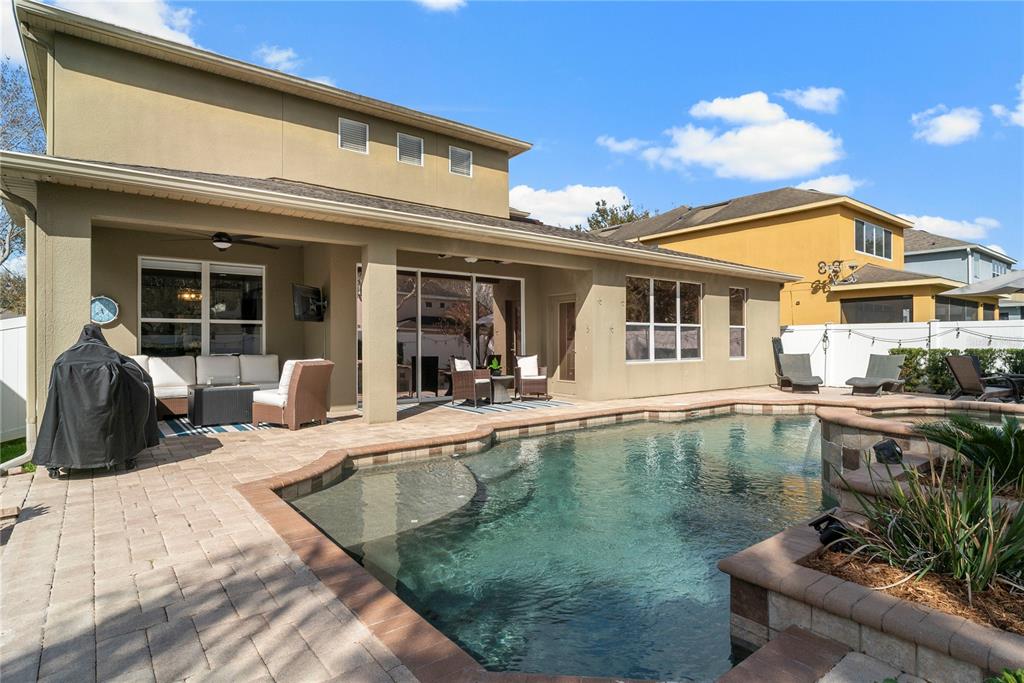 13320 Fernow Street Windermere, FL 34786 - Photo 45 of 52 a view of a swimming pool with two chairs in patio