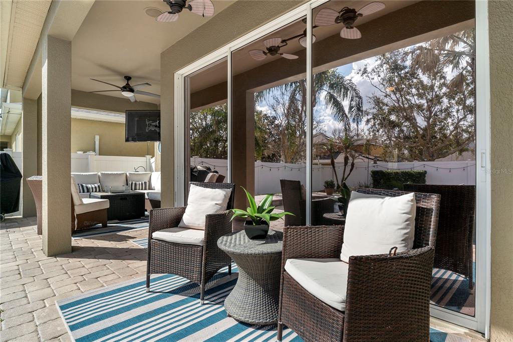 13320 Fernow Street Windermere, FL 34786 - Photo 46 of 52 a outdoor space with patio the couches and a dining table with the garden view