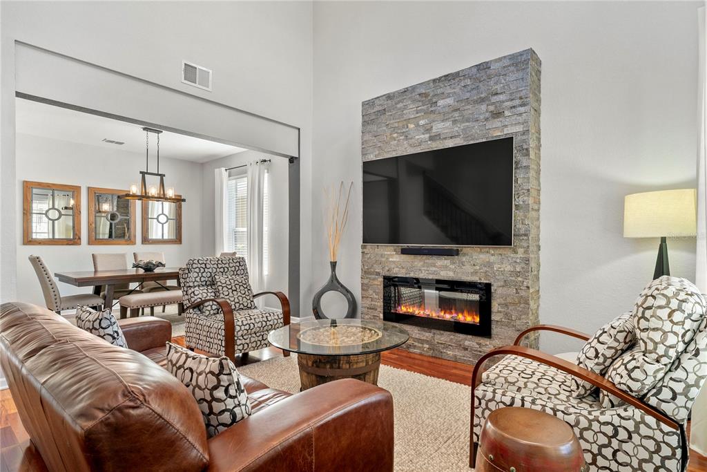 13320 Fernow Street Windermere, FL 34786 - Photo 8 of 52 a living room with furniture fireplace and flat screen tv