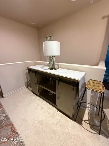 a room with a sink and a bed