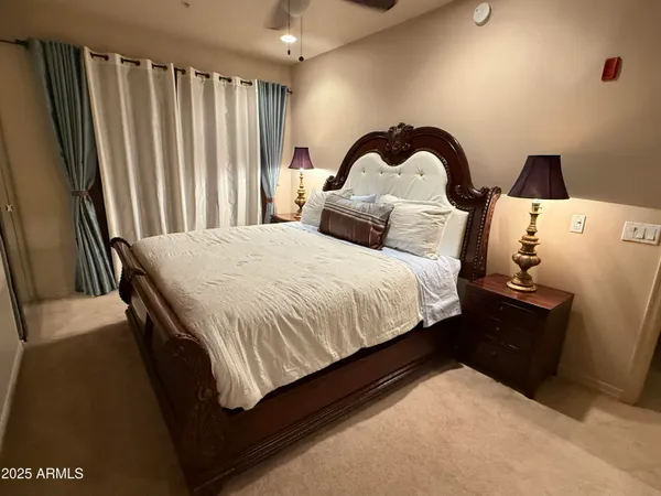 a bedroom with a bed and a dresser