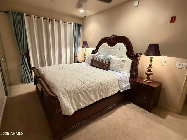 a bedroom with a bed and a dresser