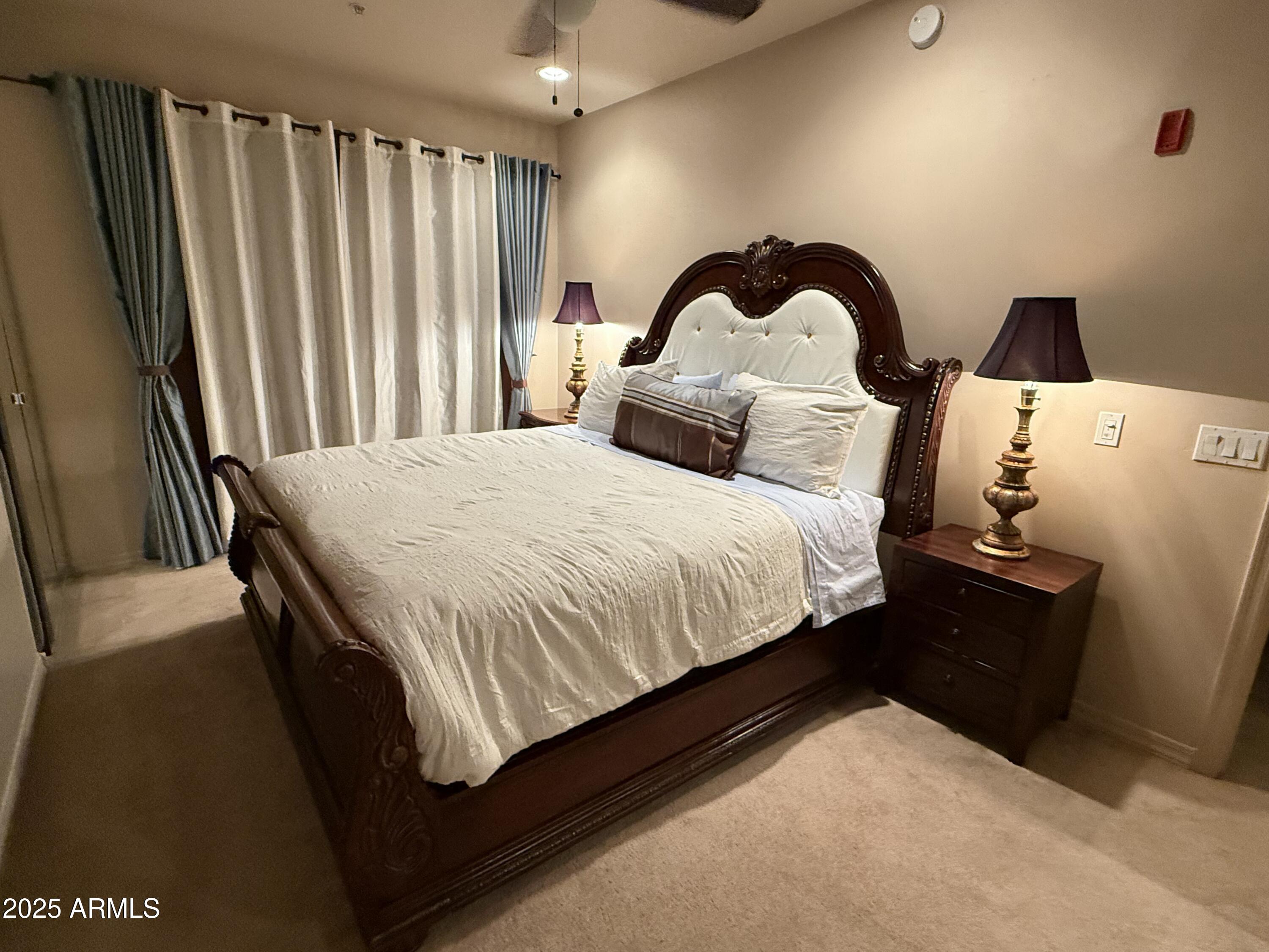 20660 North 40th Street, Unit 2137 Phoenix, AZ 85050 - Photo 19 of 22 a bedroom with a bed and a dresser