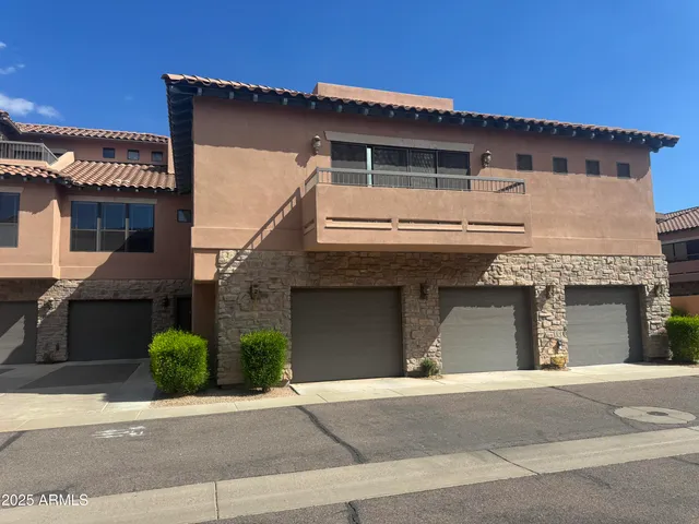 a front view of a house with garage