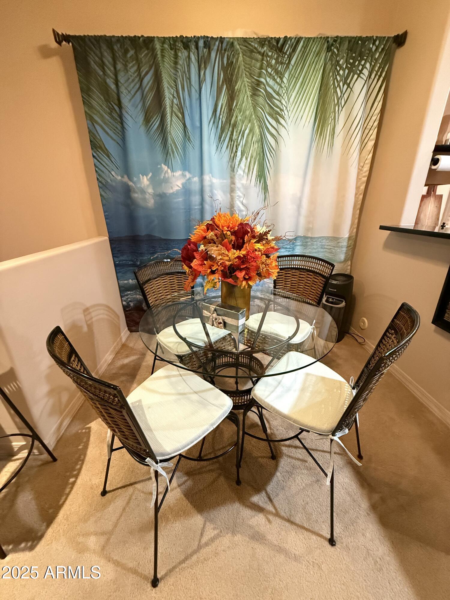 20660 North 40th Street, Unit 2137 Phoenix, AZ 85050 - Photo 22 of 22 a dining room with furniture and a potted plant