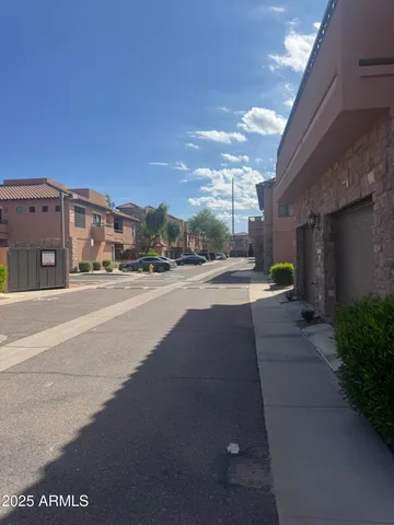 a view of a street with a building in the background