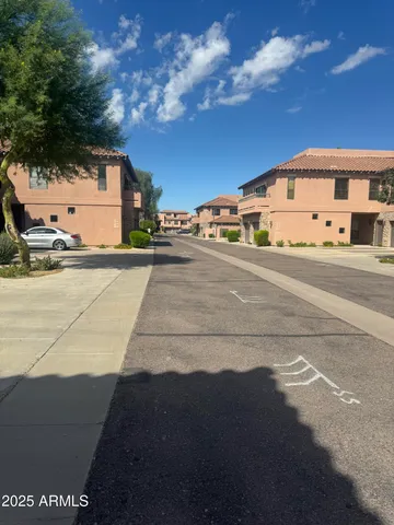 a view of a street with a building in the background
