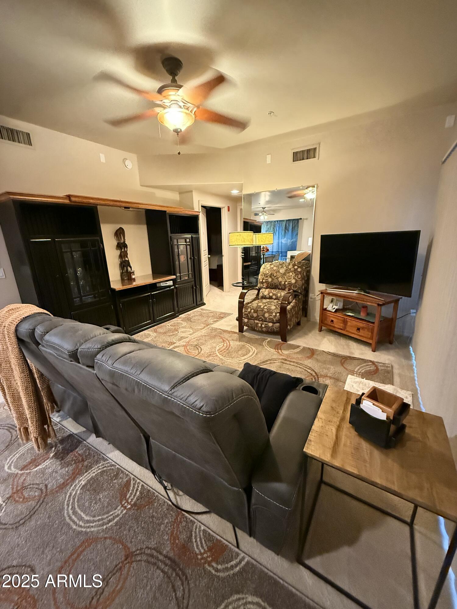 20660 North 40th Street, Unit 2137 Phoenix, AZ 85050 - Photo 7 of 22 a bedroom with a bed and wooden floor
