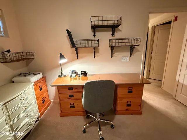 a bed room with furniture and a mirror