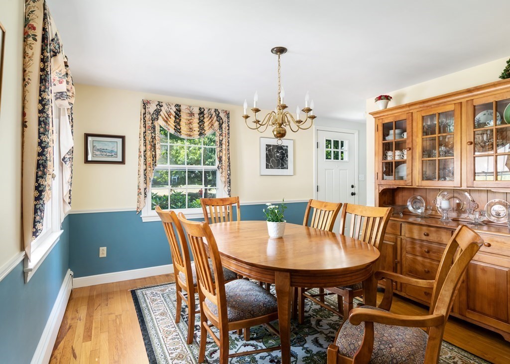 17 Winthrop Road Hingham, MA 02043 - Photo 11 of 27 a view of a dining room with furniture wooden floor and chandelier