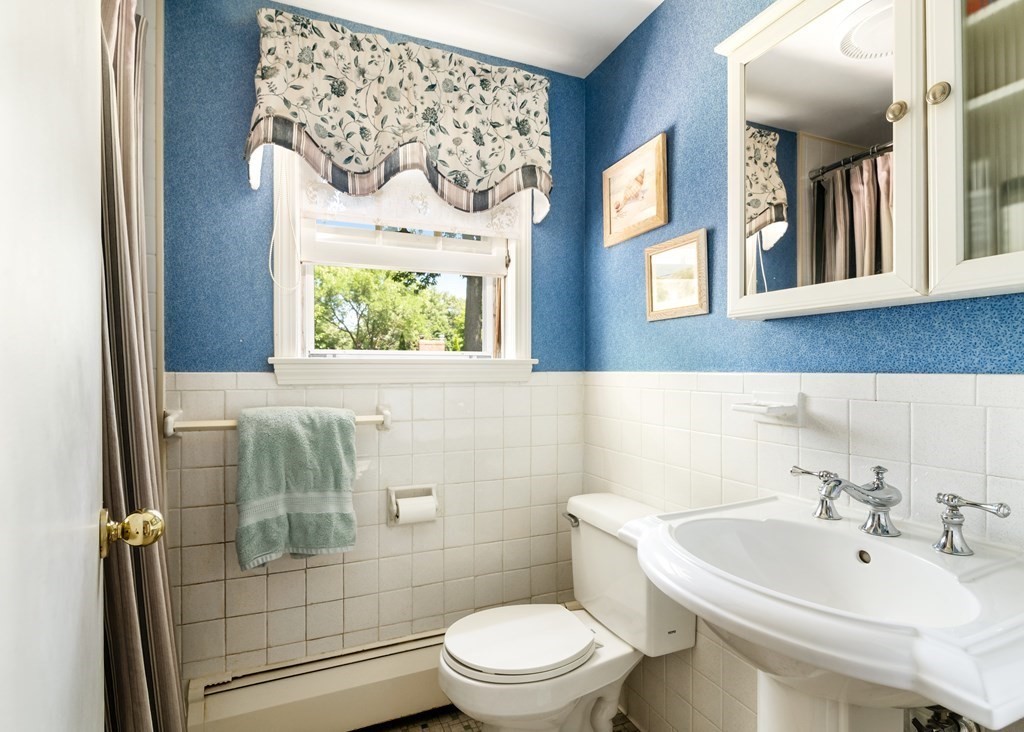 17 Winthrop Road Hingham, MA 02043 - Photo 15 of 27 a bathroom with a sink toilet and mirror