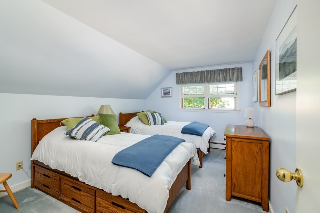 17 Winthrop Road Hingham, MA 02043 - Photo 16 of 27 a bedroom with a bed and wooden floor