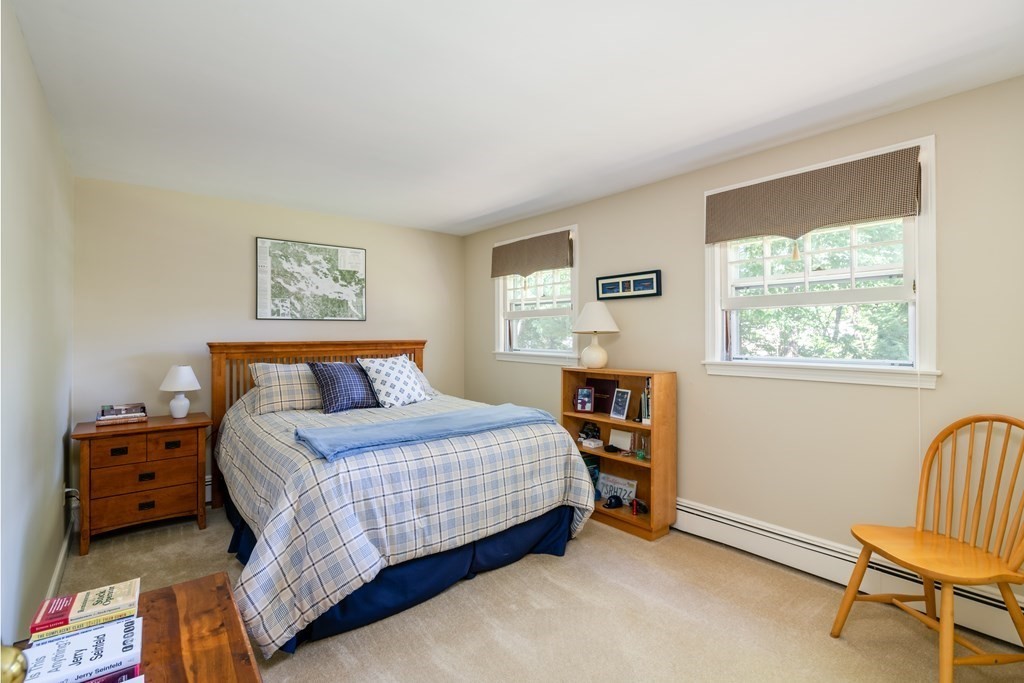 17 Winthrop Road Hingham, MA 02043 - Photo 17 of 27 a bedroom with a bed a couch and a window