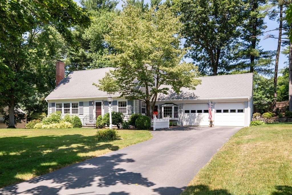 17 Winthrop Road Hingham, MA 02043 - Photo 2 of 27 a view of a white house with a big yard and potted plants and large tree