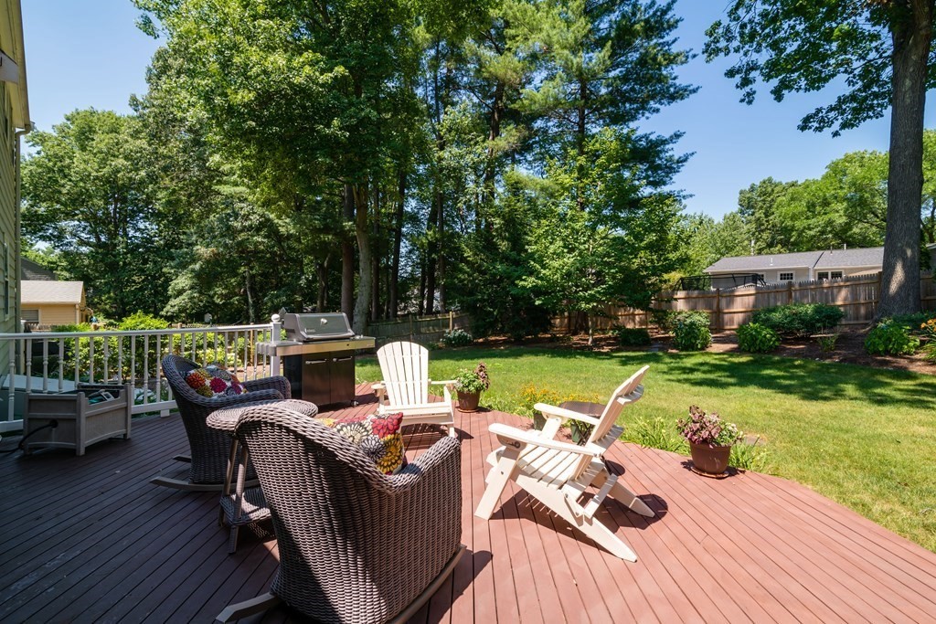 17 Winthrop Road Hingham, MA 02043 - Photo 21 of 27 a view of a patio with table and chairs potted plants with wooden floor and fence