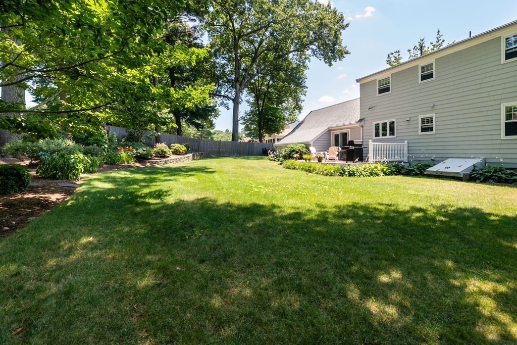 17 Winthrop Road Hingham, MA 02043 - Photo 23 of 27 a view of a house with a big yard and large trees