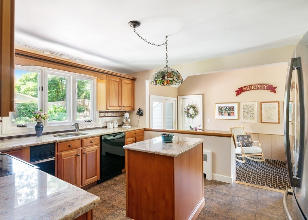 17 Winthrop Road Hingham, MA 02043 - Photo 7 of 27 a kitchen with stainless steel appliances granite countertop a sink stove and refrigerator