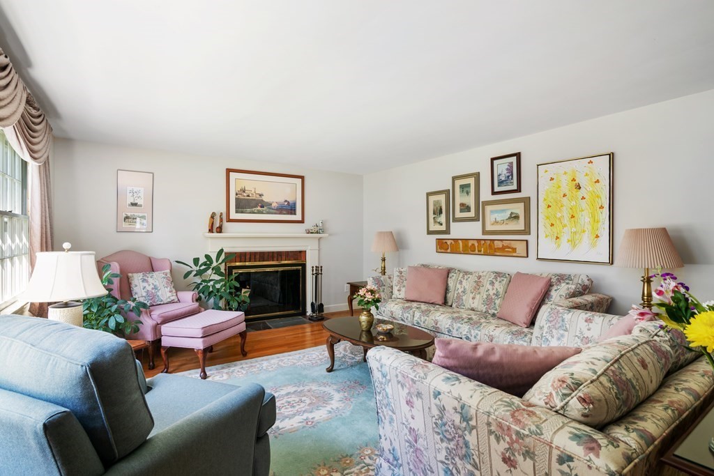 17 Winthrop Road Hingham, MA 02043 - Photo 9 of 27 a living room with furniture a fireplace and a window