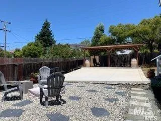 a view of balcony with wooden floor and outdoor seating