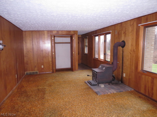 12212 Darrow Road Vermilion, OH 44089 - Photo 14 of 23 Family Room with Wood Burner
