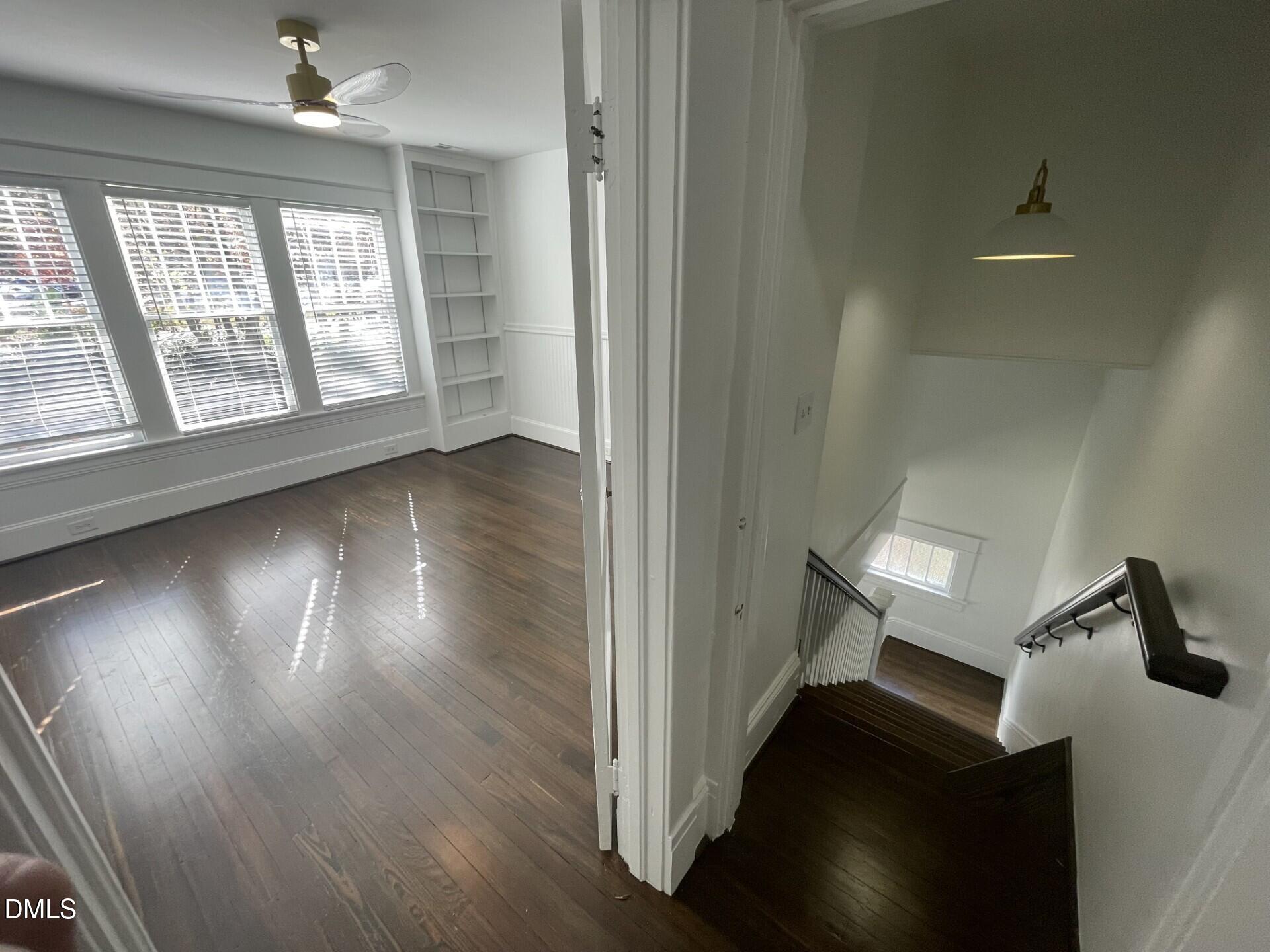 313 Calvin Road Raleigh, NC 27605 - Photo 29 of 39 wooden floor in an empty room with a window