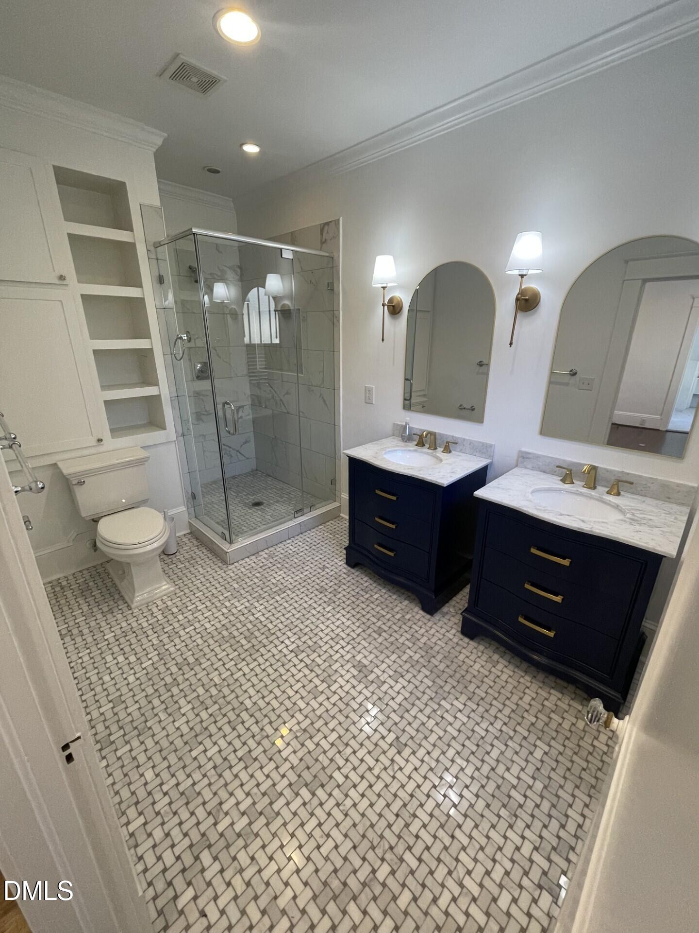 313 Calvin Road Raleigh, NC 27605 - Photo 32 of 39 a bathroom with a double vanity sink toilet and shower