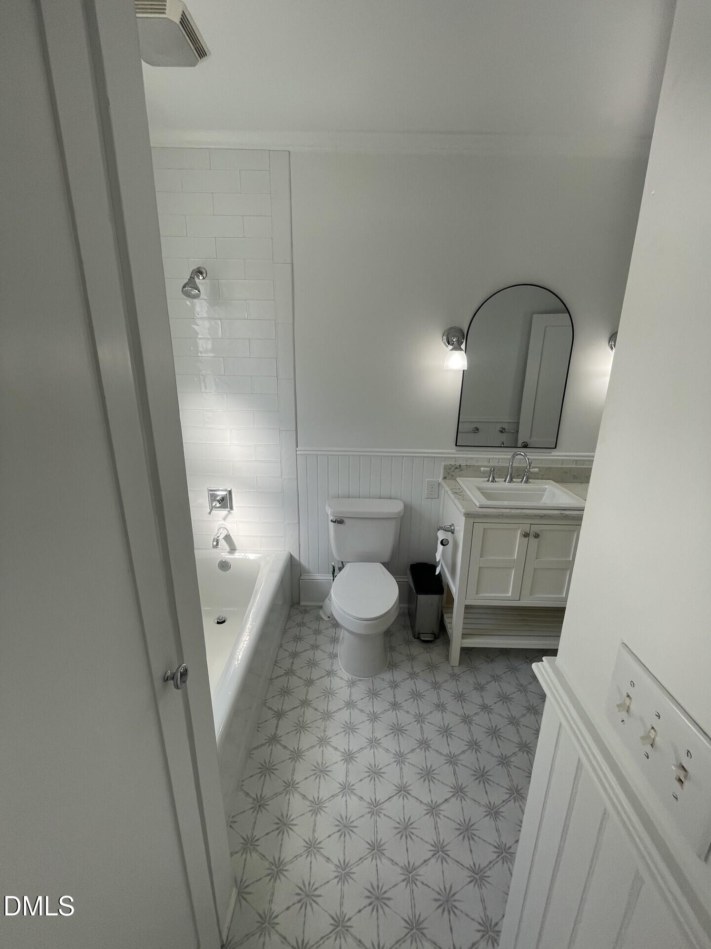 313 Calvin Road Raleigh, NC 27605 - Photo 37 of 39 a bathroom with a sink a toilet and mirror