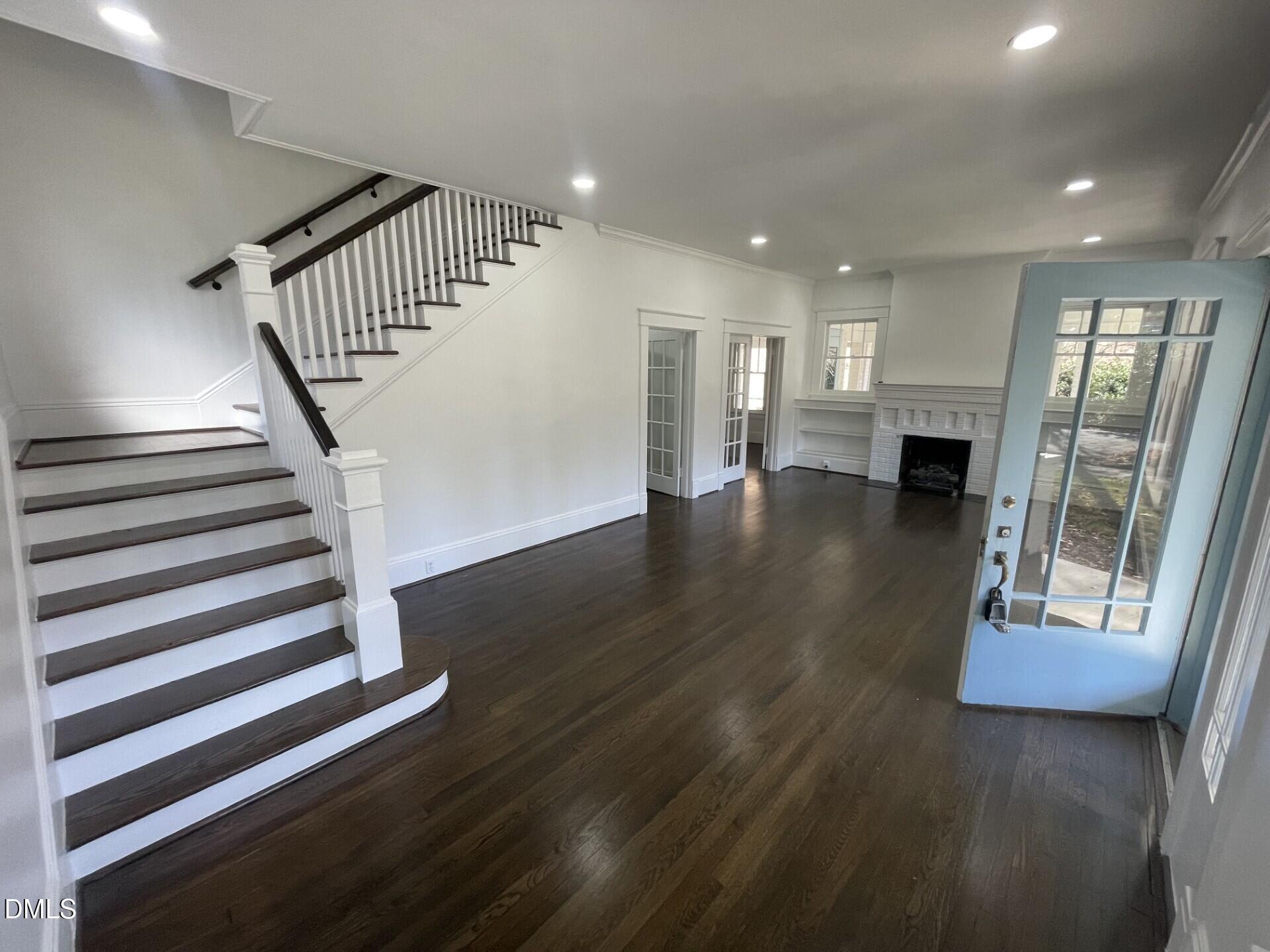 313 Calvin Road Raleigh, NC 27605 - Photo 5 of 39 a view of entryway with wooden floor
