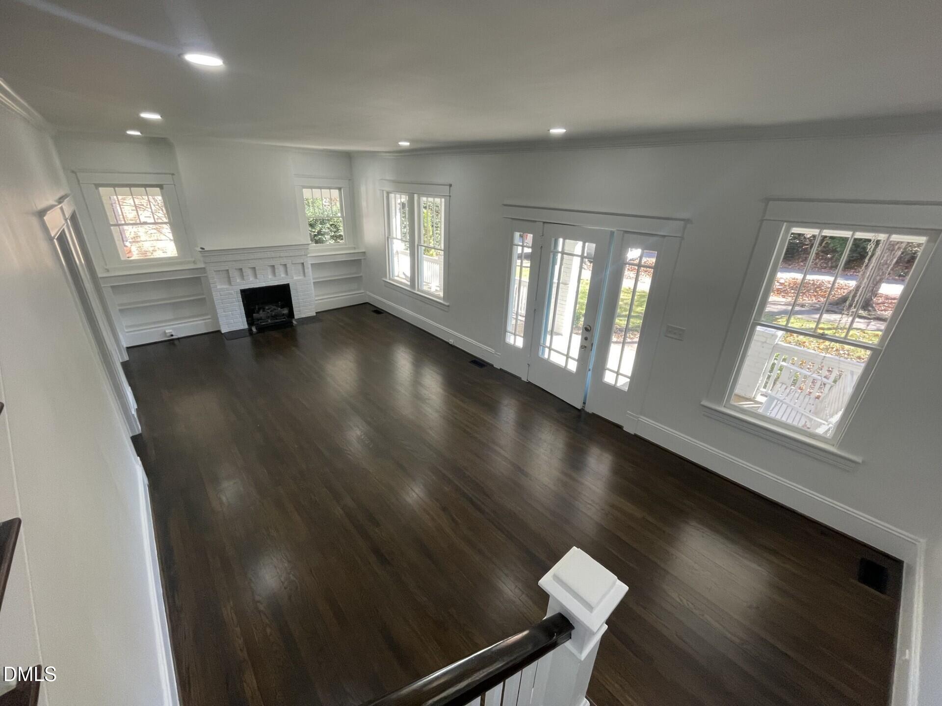 313 Calvin Road Raleigh, NC 27605 - Photo 7 of 39 an empty room with windows