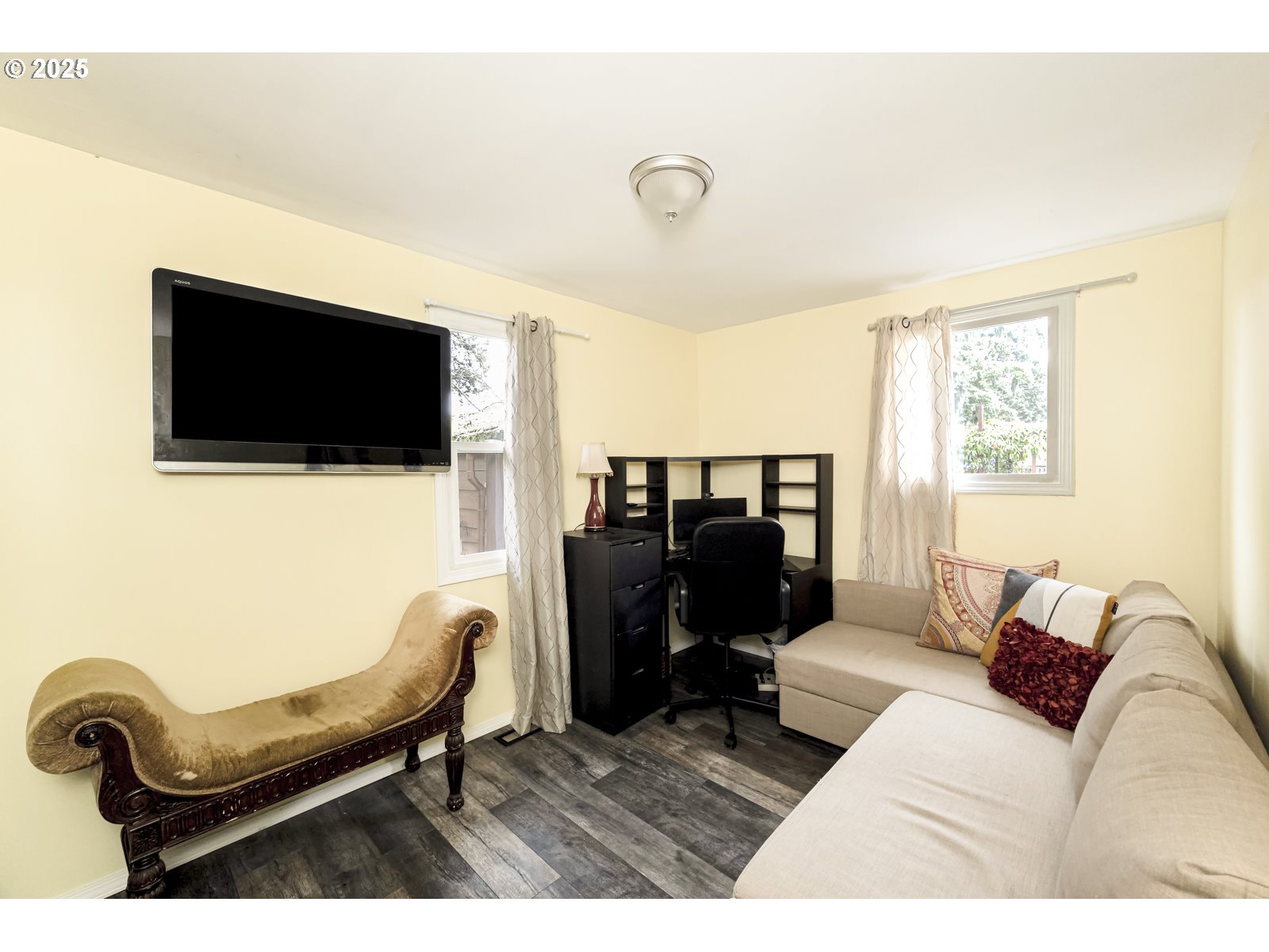 6125 Southeast 138th Place Portland, OR 97236 - Photo 21 of 32 a living room with furniture and a flat screen tv