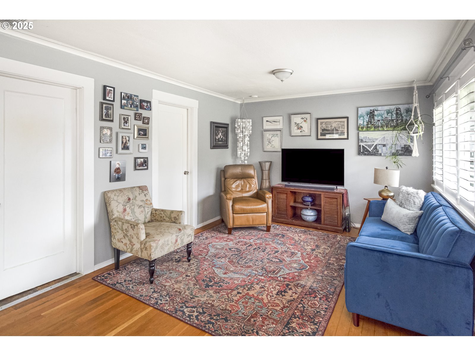 6125 Southeast 138th Place Portland, OR 97236 - Photo 3 of 32 a living room with furniture a flat screen tv and a window