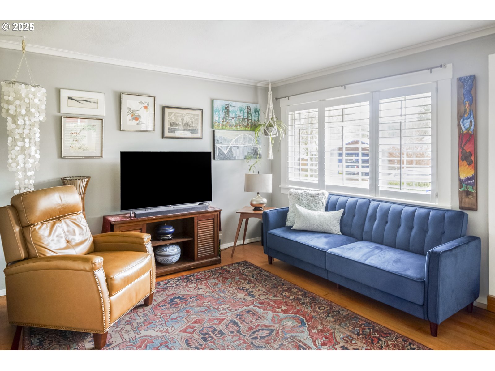 6125 Southeast 138th Place Portland, OR 97236 - Photo 4 of 32 a living room with furniture and a flat screen tv