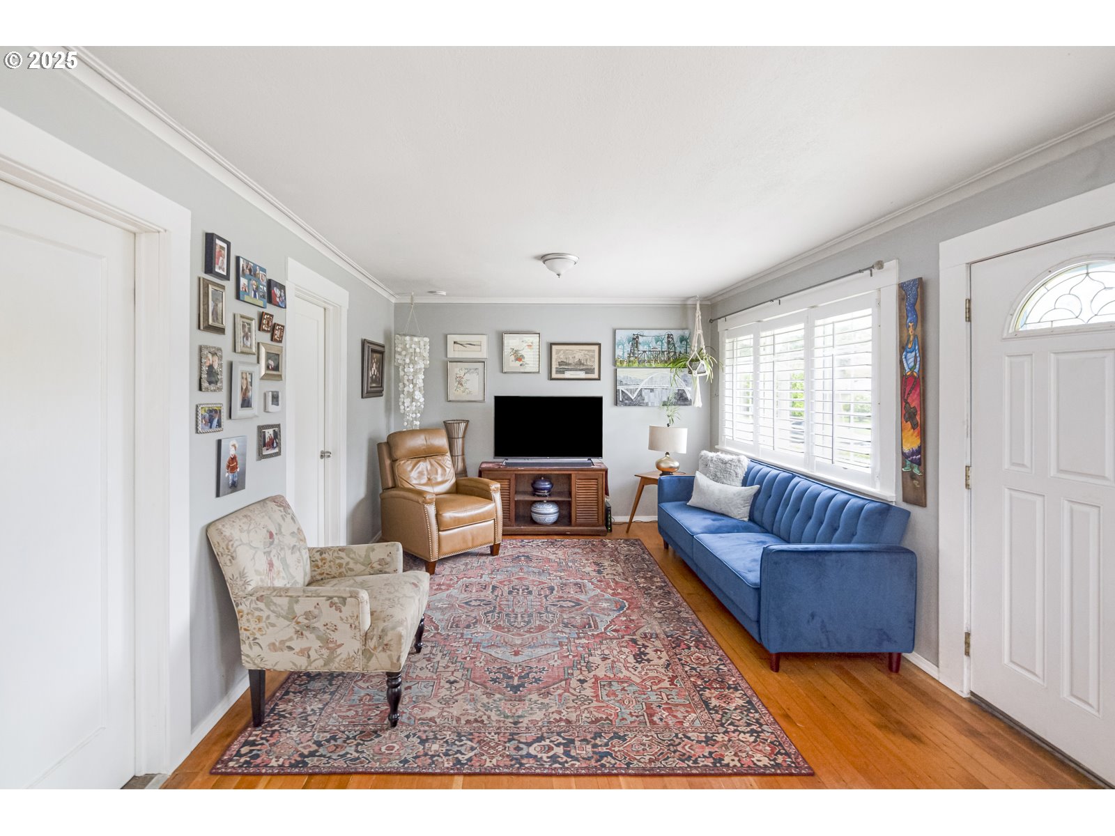 6125 Southeast 138th Place Portland, OR 97236 - Photo 5 of 32 a living room with furniture and a flat screen tv