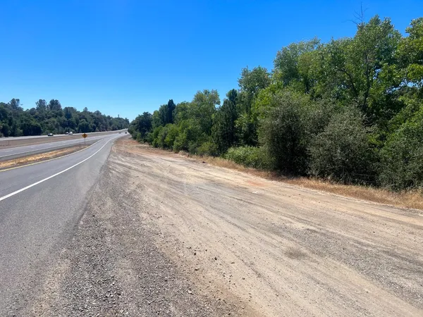 a view of a road with a yard