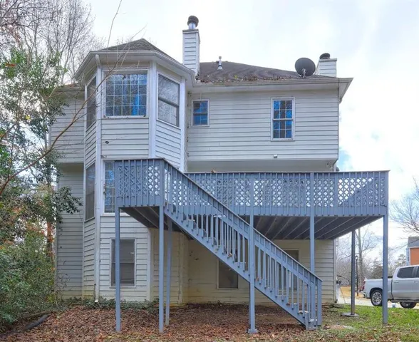 a view of a house with a deck