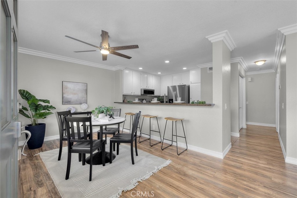 22206 Rim Pointe, Unit 7G Lake Forest, CA 92630 - Photo 11 of 39 a view of a dining room with furniture