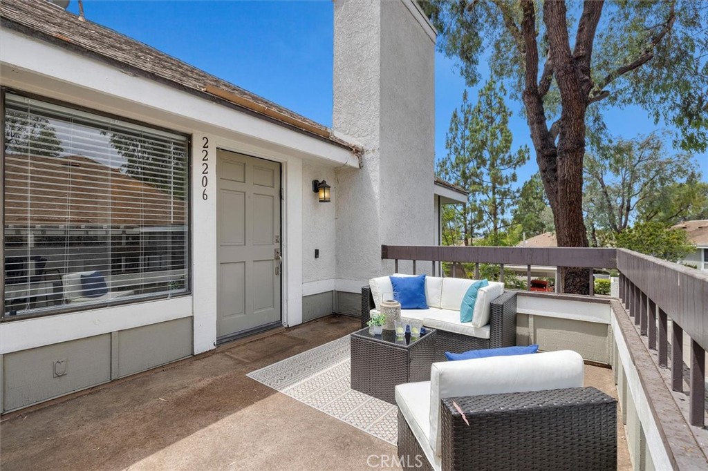 22206 Rim Pointe, Unit 7G Lake Forest, CA 92630 - Photo 3 of 39 a patio with patio couch and table