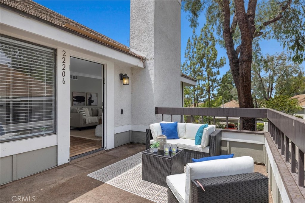 22206 Rim Pointe, Unit 7G Lake Forest, CA 92630 - Photo 4 of 39 a outdoor living space with furniture and a potted plant