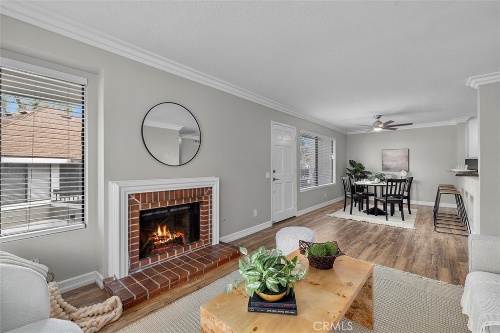 22206 Rim Pointe, Unit 7G Lake Forest, CA 92630 - Photo 8 of 39 a living room with furniture and a fireplace